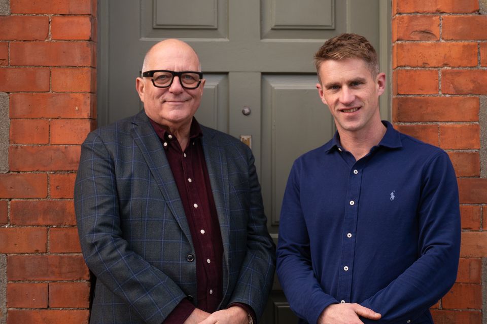 Architect Hugh Wallace and Sean Hickey outside Mr Hickey's house in Kilkenny
